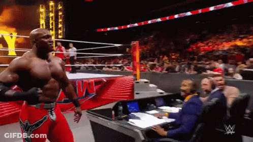 Wrestler Leaving Ring With Referee GIF