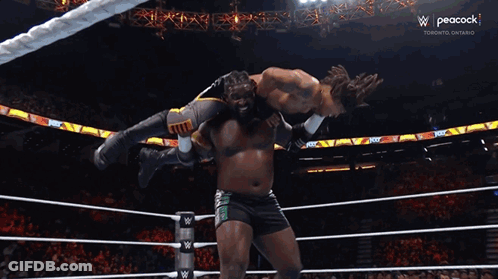 Wrestler Lifted By Another As Referee Watches GIF