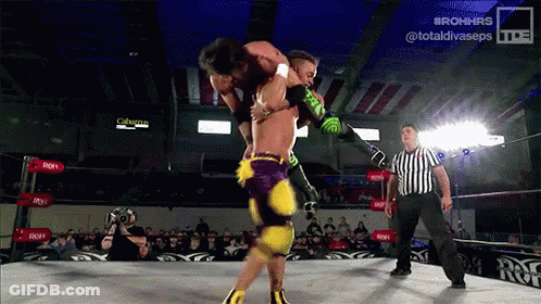 Wrestler Lifted By Another While Referee Watches GIF