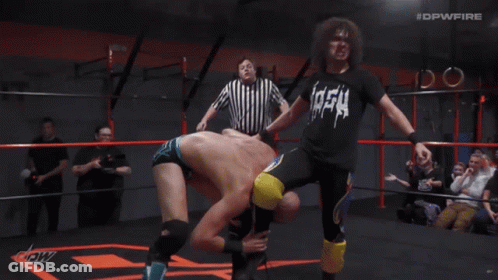 Wrestler Lifting Another Wrestler Saying Pen GIF