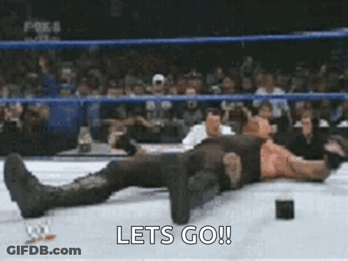 Wrestler Lying On Ring With Lets Go GIF
