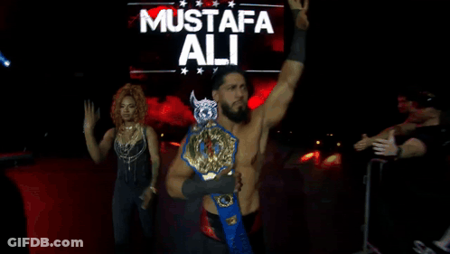 Wrestler Mustafa Ali Holding Wrestling Belt GIF