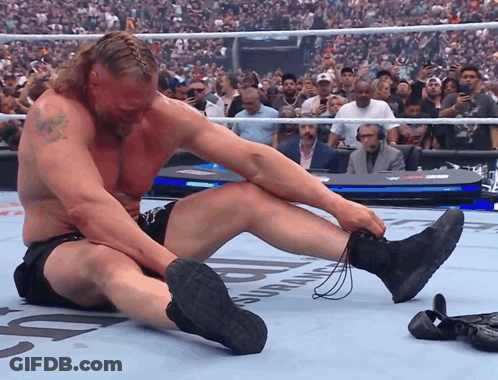 Wrestler Sitting Crossed Legs Crowd Watching GIF