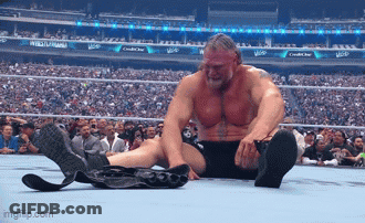 Wrestler Sitting With Crossed Feet And Belt On Ground GIF
