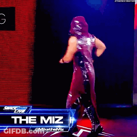 Wrestler Standing Before The Miz Sign GIF