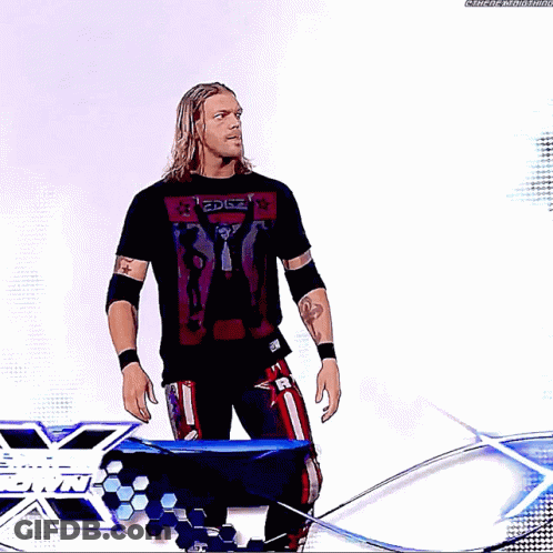 Wrestler Standing In Front Of Edge Sign GIF