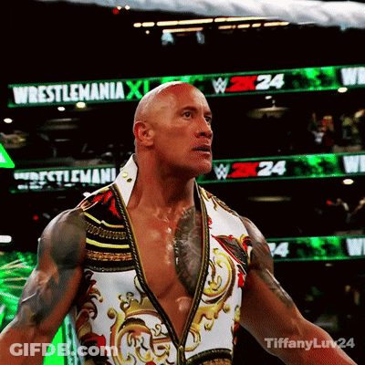 Wrestler Standing In Front Of Wrestlemania Sign GIF