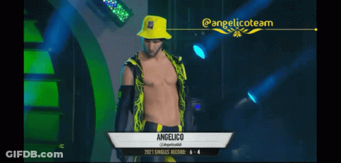Wrestler Standing In Front Of Wrestling Sign GIF