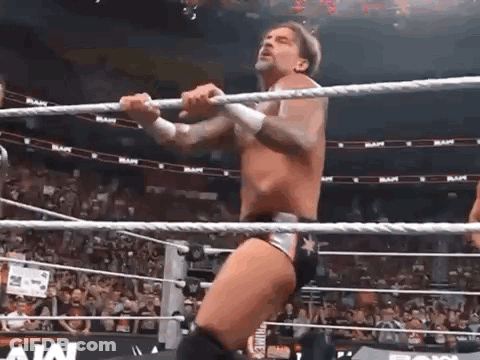 Wrestler Standing In Ring Holding Rope GIF