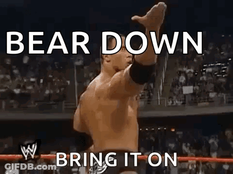 Wrestler Standing In Ring With Arms Up Saying Bear Down Bring It On GIF