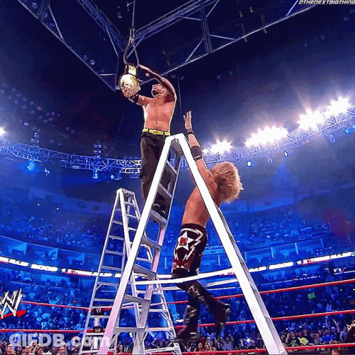 Wrestler Standing On Ladder Holding Rope GIF
