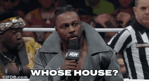 Wrestler Talking Into Microphone With Referee GIF