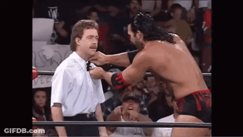 Wrestler Tying Referee's Neck GIF