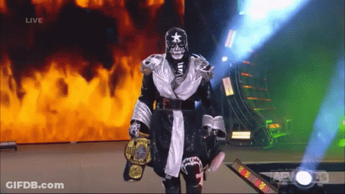 Wrestler Walking Down Aisle Holding Championship Belt GIF
