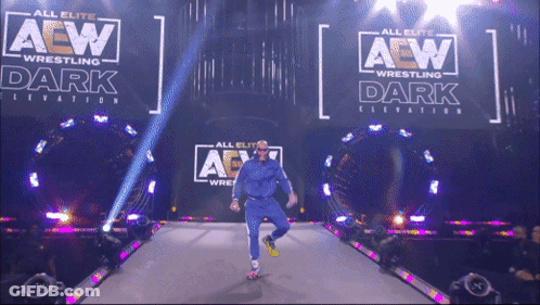 Wrestler Walking Down Aisle In Front Of AEW Sign GIF
