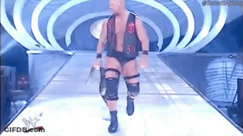 Wrestler Walking Down Ramp Holding Sword GIF