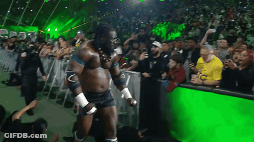 Wrestler Walking In Front Of Crowd GIF