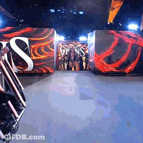 Wrestler Walking Into Ring With Join My Sins Sign GIF