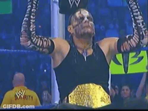 Wrestler With Arms Up Wearing WWE Championship Belt GIF