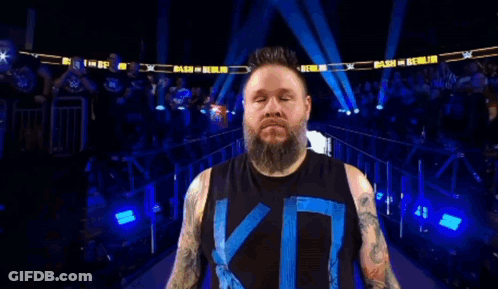 Wrestler With Beard And Tattoos In Ring GIF