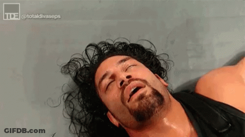 Wrestler With Beard Lying Down GIF