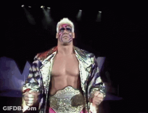 Wrestler With Belt Standing In Darkness GIF