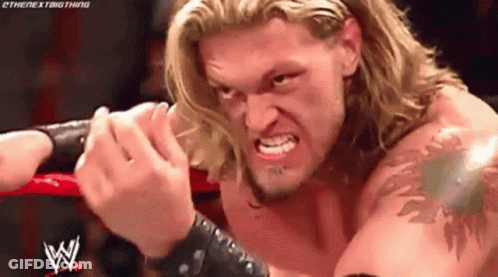 Wrestler With Blonde Hair And Tattoo In Ring GIF