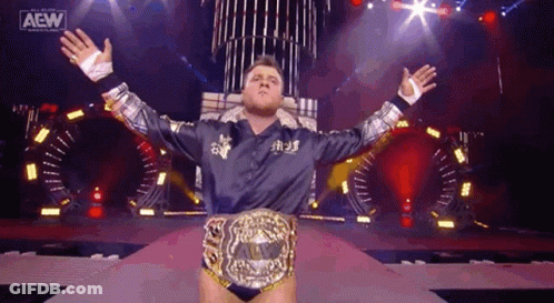 Wrestler With Championship Belt And Arms Outstretched GIF