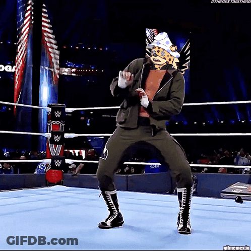 Wrestler With Cheetah Head Dancing In Ring GIF