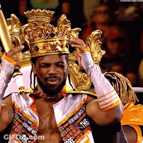 Wrestler With Crown In White And Orange Outfit GIF