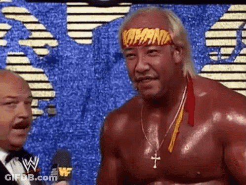 Wrestler With Headband Talking To Suit GIF