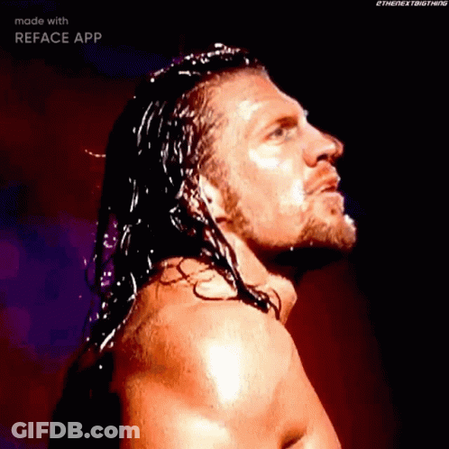 Wrestler With Long Hair And Beard Standing In Dark GIF