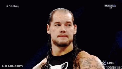 Wrestler With Long Hair And Cat Shirt In Ring GIF