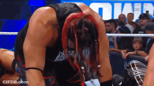 Wrestler With Red Dreadlocks Kneeling GIF
