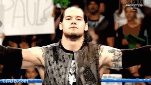Wrestler With Sign Saying Paul GIF