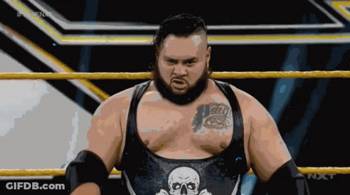 Wrestler With Skull On Chest In Ring GIF