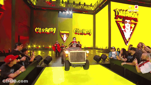 Wrestler With White Face And Red Cape GIF