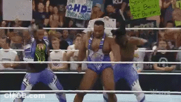 Wrestlers Dancing In Ring With RHD Sign GIF