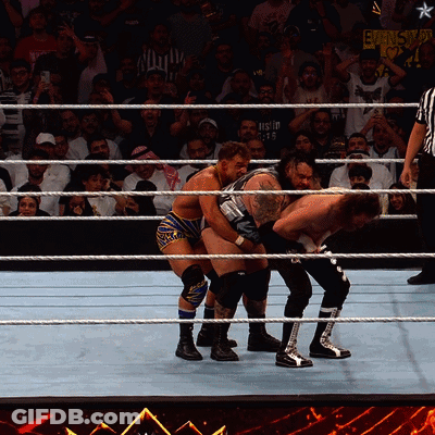 Wrestlers In A Ring With A Sign Behind Them That Says ' Ecw ' On It GIF