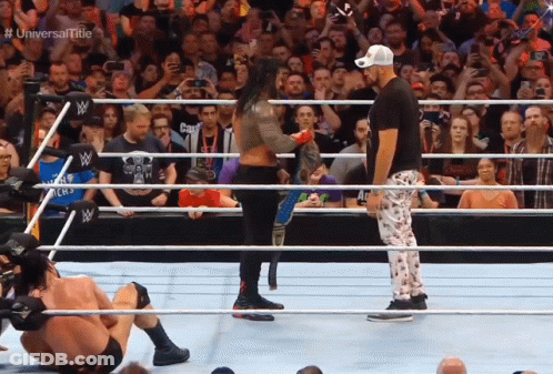Wrestlers In A Ring With The Words Universal Title On The Bottom Right GIF