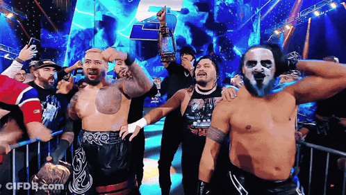 Wrestlers In Front Of Crowd One Wearing WWE Shirt GIF