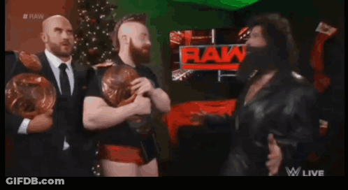 Wrestlers In Front Of RAW Sign GIF