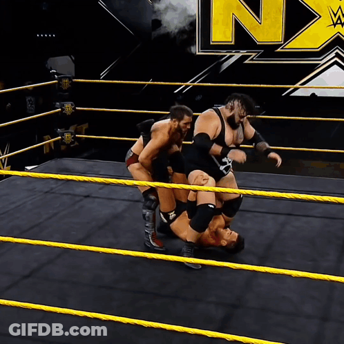 Wrestlers In Ring With N On Wall GIF