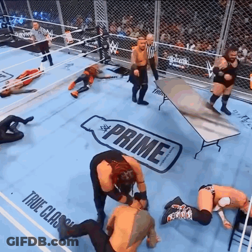 Wrestlers In Ring With Prime Table GIF