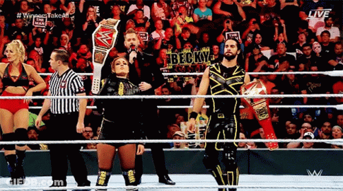 Wrestlers In Ring With Referee And Becky Sign GIF