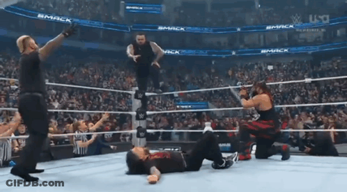 Wrestlers In Ring With Smack Sign GIF