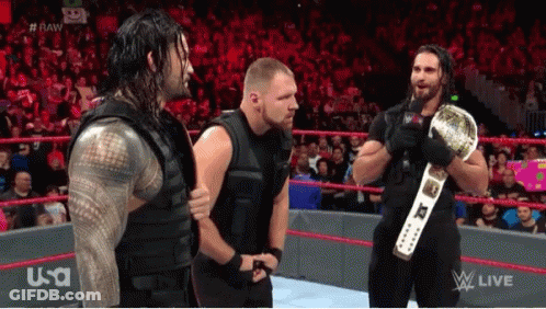 Wrestlers In Ring With World Heavyweight Championship Belt GIF