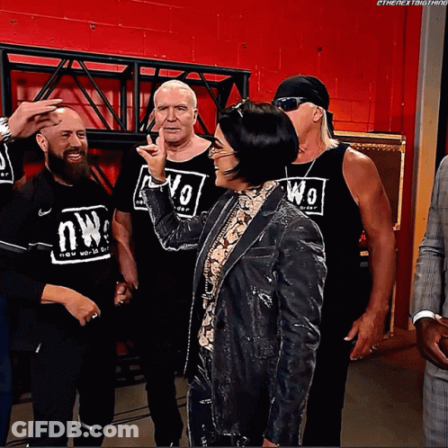 Wrestlers Posing One Wearing NW Shirt GIF