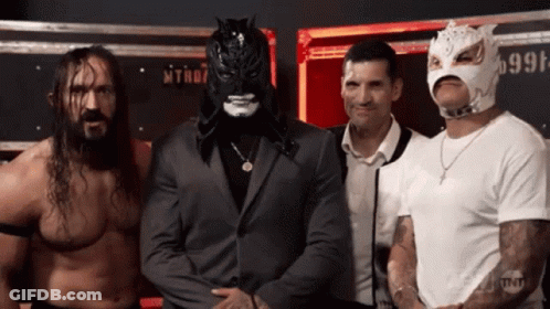 Wrestlers Posing With Mask Number 999 GIF