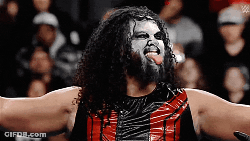 Wrestlers Standing In Front Of Solo Bikoa Banner GIF